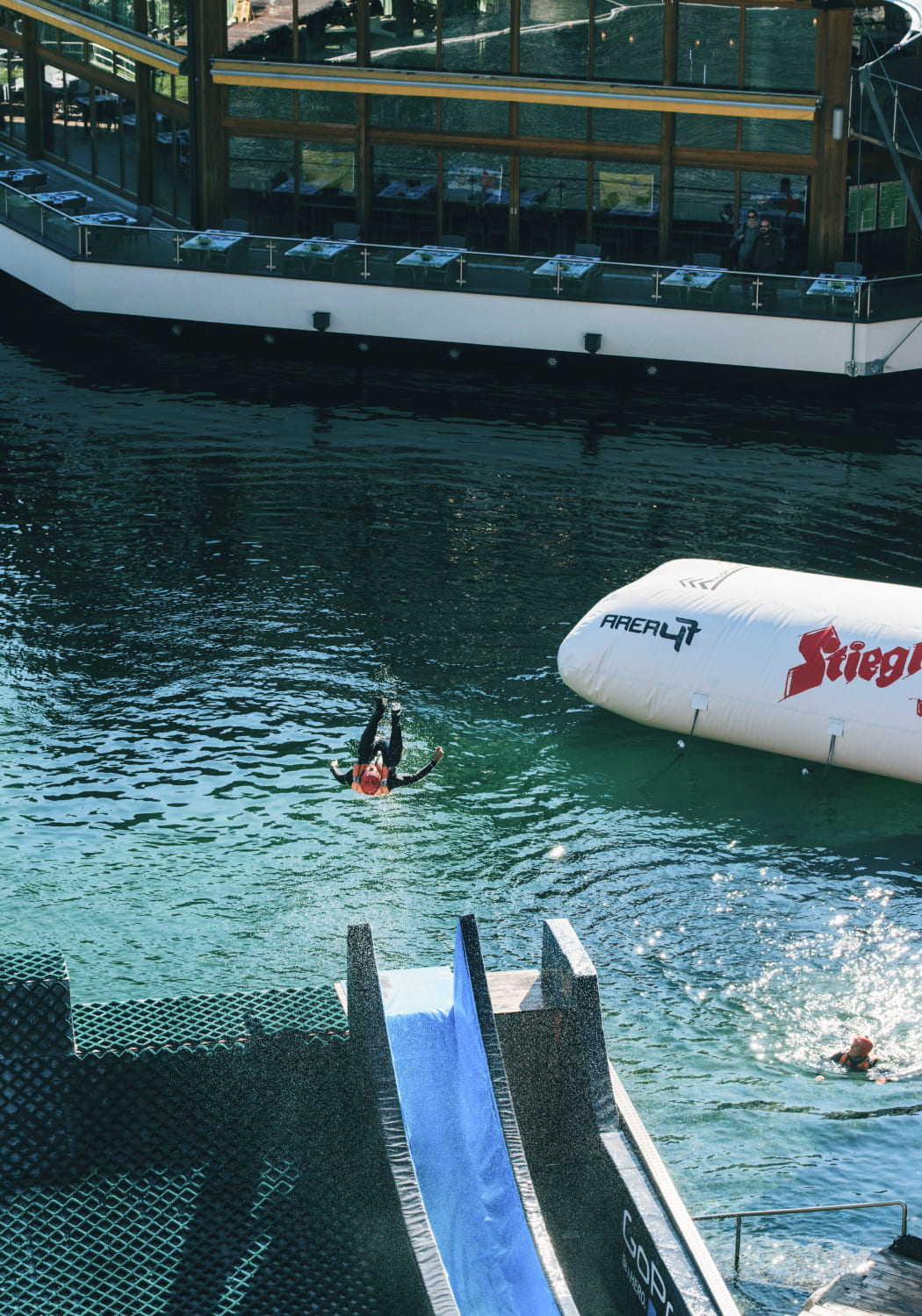 Person is thrown into the water by the blobbing water catapult at AREA 47, Ötztal, Tyrol