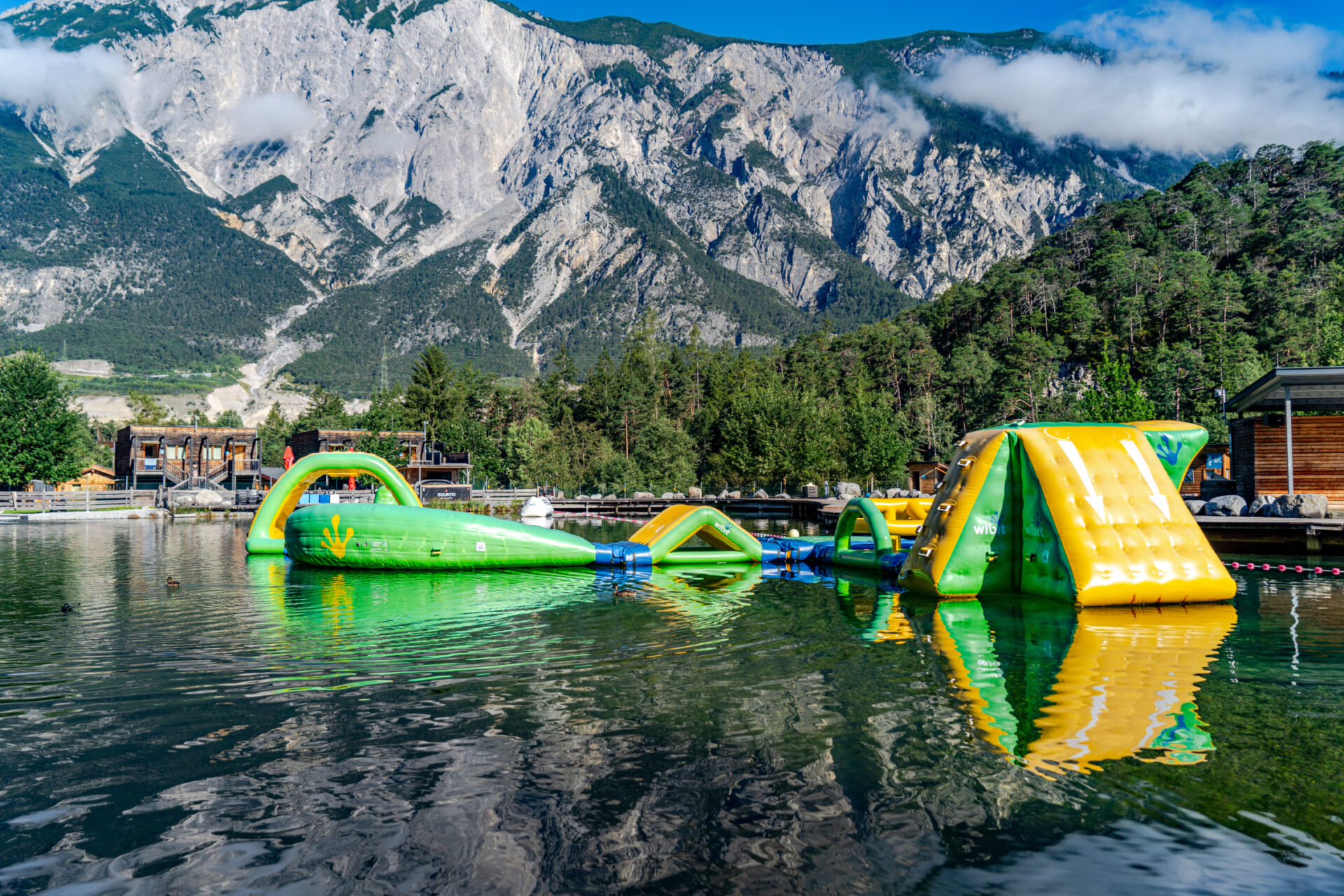 Inflatable obstacles on the Splashtrack at AREA 47 in Ötztal, Tyrol, against a mountain backdrop