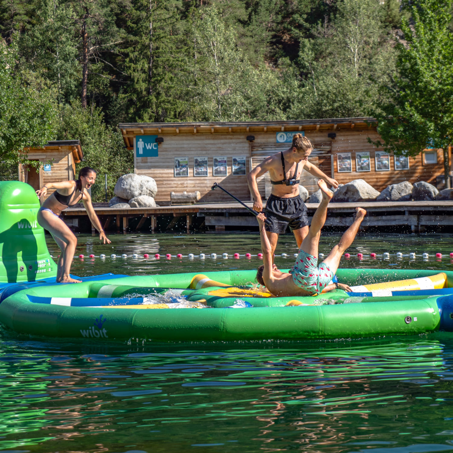 Group on a floating obstacle in the Water Area of AREA 47 in Ötztal, Tyrol