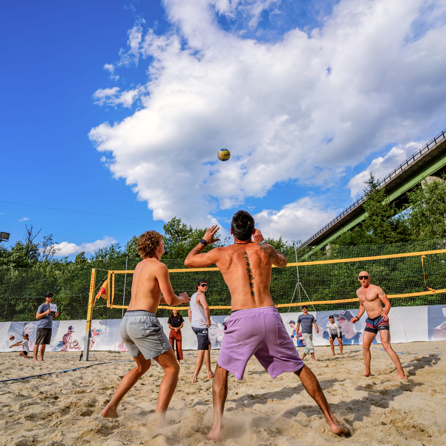 Group of people playing beach volleyball on a sand court at AREA 47 in Ötztal, Tyrol