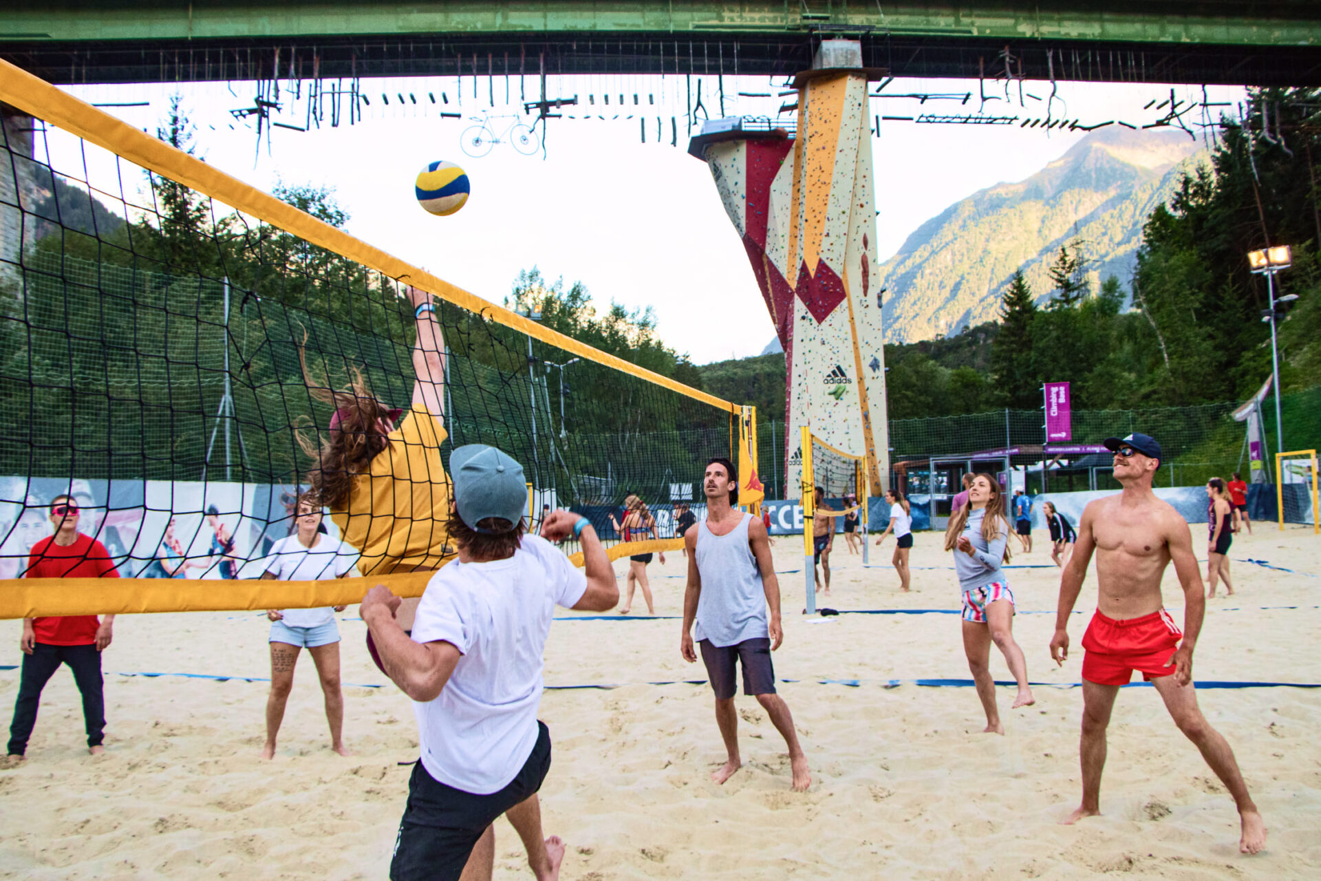 Group of people playing beach volleyball on a sand court at AREA 47 in Ötztal, Tyrol