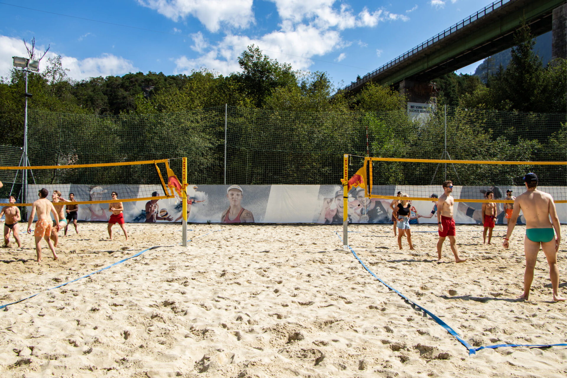 Group of people playing beach volleyball on a sand court at AREA 47 in Ötztal, Tyrol