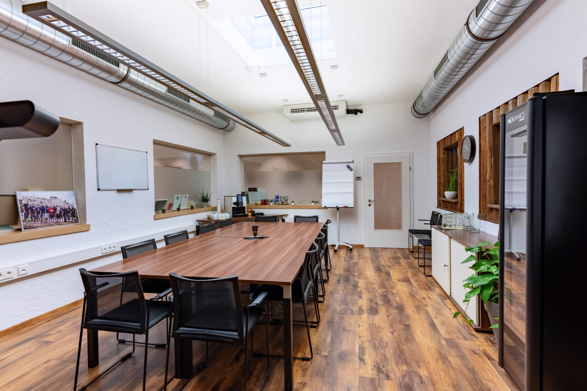Modern meeting room with wooden table and flipchart in AREA 47, Ötztal, Tyrol