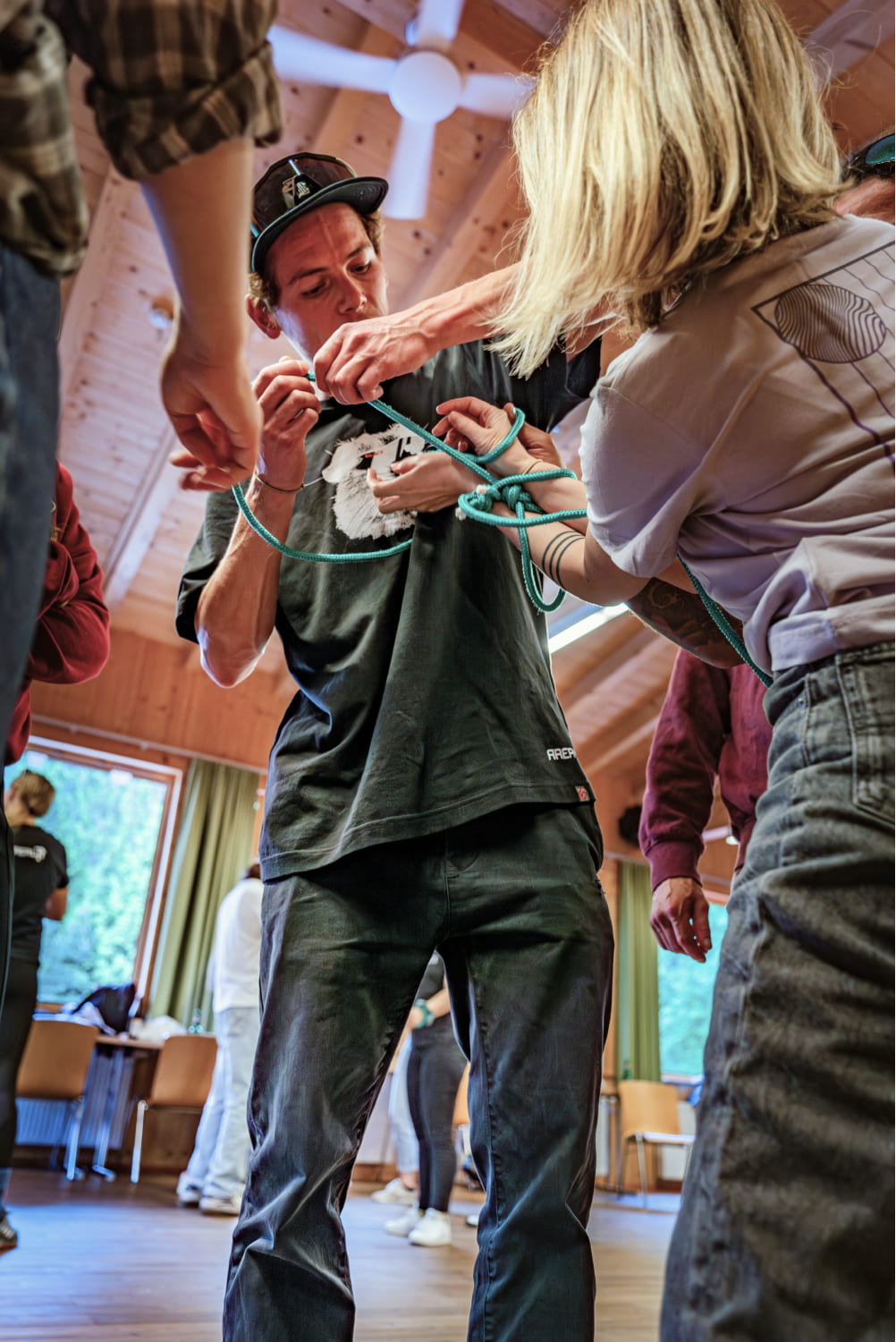 Participants engaged in a team-building rope exercise at AREA 47, Ötztal, Tirol