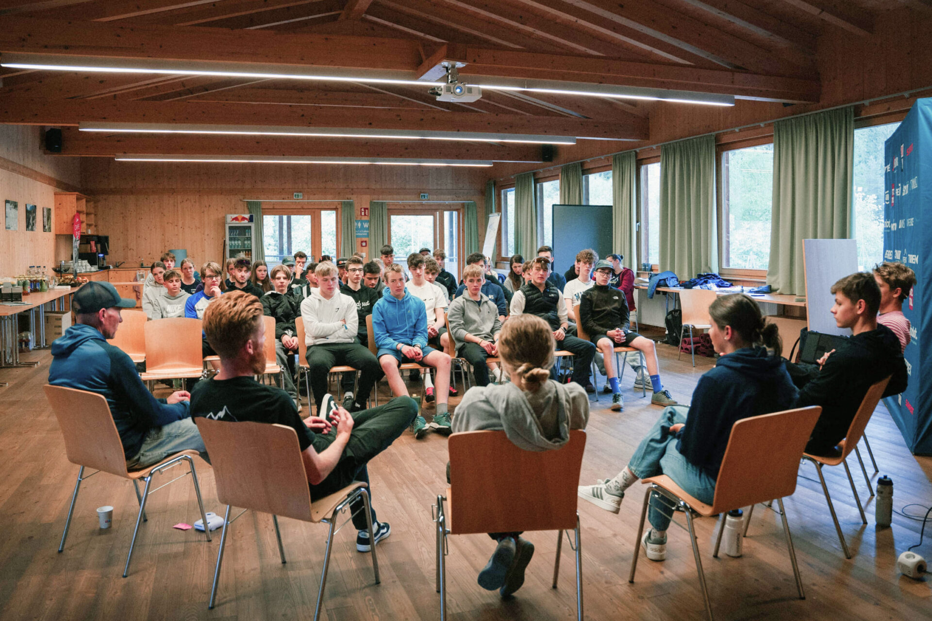 A group discussion in a seminar room with young participants at AREA 47, Ötztal, Tirol